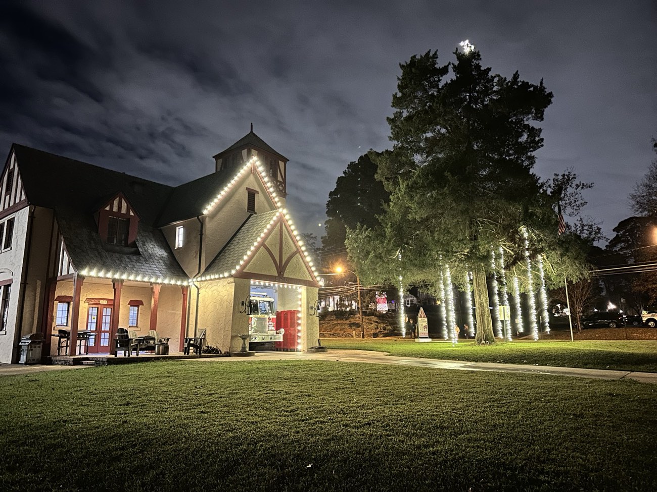 Commercial building and mature trees lit for Christmas downtown